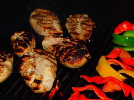 Fresh Grilled Chicken Breasts and Vegetables on the Barbecue