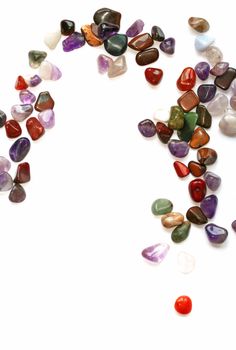 Colorful semiprecious stones on white background