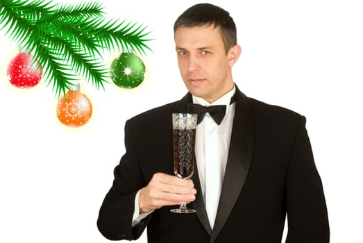 The happy man in a classical tuxedo in an anticipation of New Year's holidays