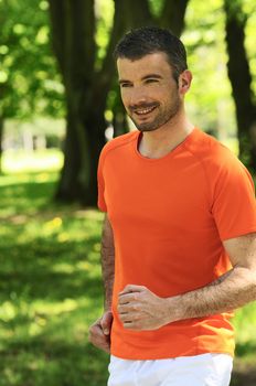 sportive and cheerful man in a natural background