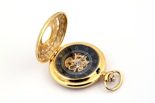 Gold pocket watch on a white background.