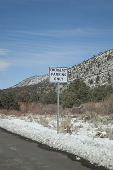 mountain range with an empty road and blue skies.