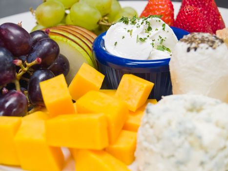 Cheese and Fruit Arranged on a Plate