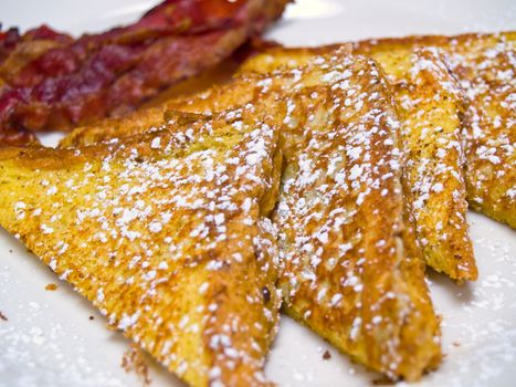 French Toast dusted with Powdered Sugar and Bacon