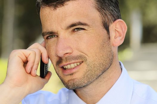 businessman is having a communication with his cellphone