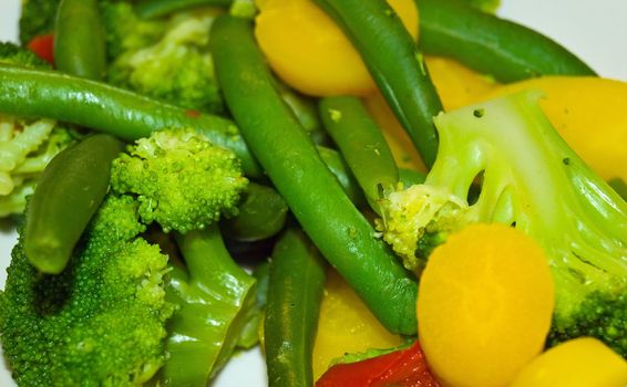 Fresh Steamed Vegetables Green Beans, Broccoli and Yellow Carrots