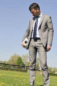 Business man coaching soccer