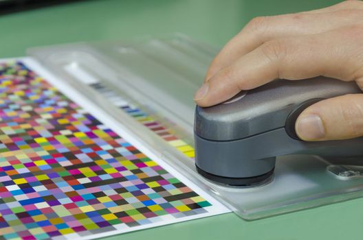 spectrophotometer measurment of color patches on Test Arch, print plant prepress department
