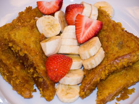 French Toast with Sliced Bananas and Strawberries