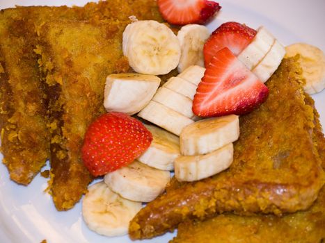 French Toast with Sliced Bananas and Strawberries