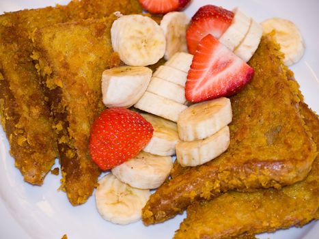 French Toast with Sliced Bananas and Strawberries