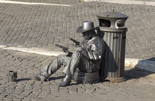 person representing the cowboy statue on the street in Roma