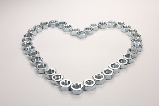 Heart of nuts on white background