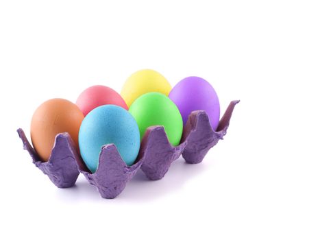 Six Easter Colored Eggs in an Egg Carton Isolated on White 