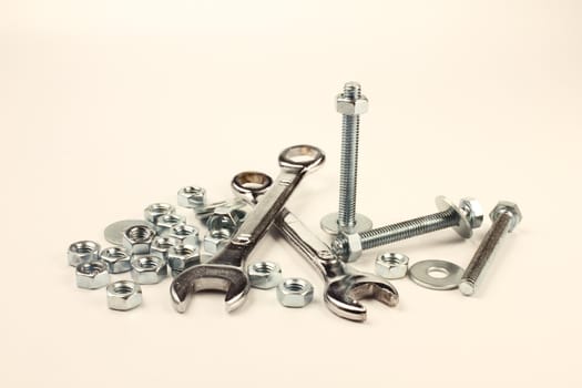 Wrenches, bolts, nuts and washers on white background.