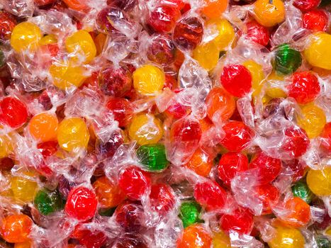 Colorful Hard Candy in Wrappers as a Background