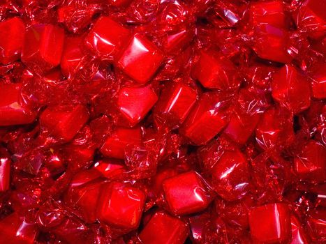 Colorful Hard Candy in Wrappers as a Background