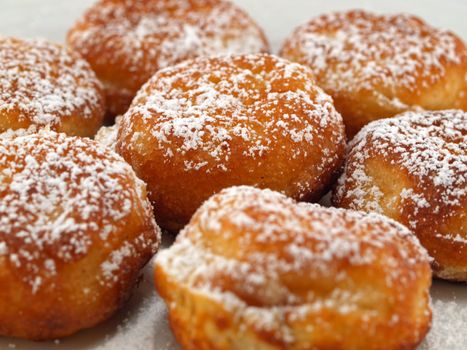 A Plate of Freshly Made Aebelskivers with Powdered Sugar