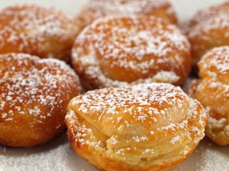 A Plate of Freshly Made Aebelskivers with Powdered Sugar