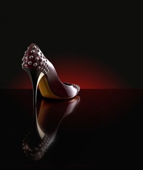 woman shoes on the dark background 