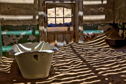 a bathroom at kolmanskop ghost town near luderitz namibia africa