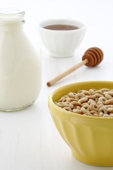 Delicious and nutritious lightly toasted honey, nuts and oats cereal with milk.