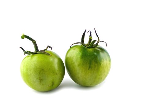 Two Green, Unripened Tomatoes Isolated oh White