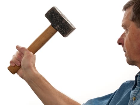 Senior male holding a large lump hammer isolated against white