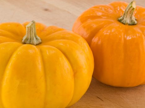 Mini Pumpkins on a Wooden Cutting Board