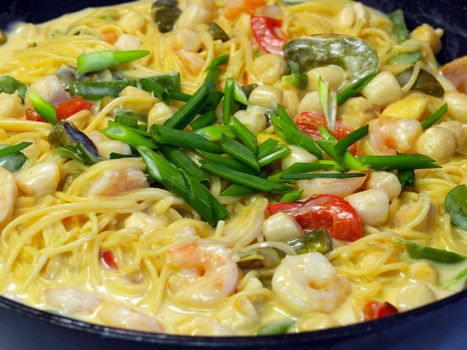 Fresh Pasta and Seafood in a Cream Sauce Garnished with Green Onions