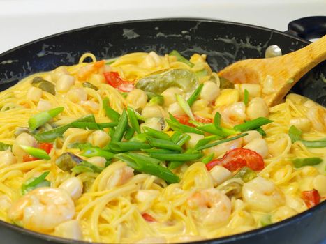 Fresh Pasta and Seafood in a Cream Sauce Garnished with Green Onions