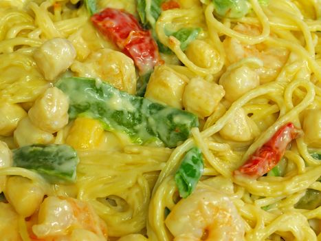 Fresh Pasta and Seafood in a Cream Sauce Garnished with Green Onions
