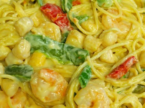 Fresh Pasta and Seafood in a Cream Sauce Garnished with Green Onions