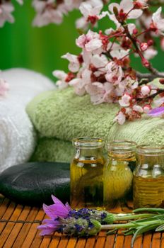 Spa scene with massage oils, lavender and towels