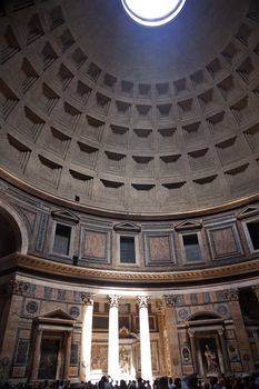 3PM Pantheon Rome Italy Basilica Palatina uilt in 27BC by Agrippa Oldest church in Rome.  The Cupola Oculus Hole in the Ceiling has a sundial effect.  At 3PM every afternoon, the three pillars lit up to tell the time