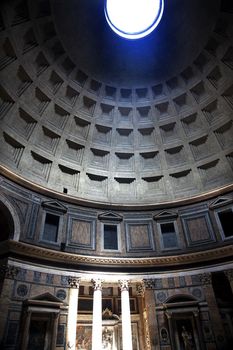 3PM Pantheon Rome Italy Basilica Palatina uilt in 27BC by Agrippa Oldest church in Rome.  The Cupola Oculus Hole in the Ceiling has a sundial effect.  At 3PM every afternoon, the three pillars lit up to tell the time