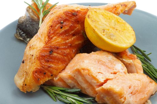 Stack of Grilled Salmon with Rosemary and Lemon closeup on Green Plate