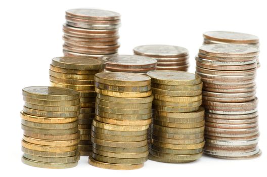 Stacks of Silver and Gold Coins closeup isolated on white background