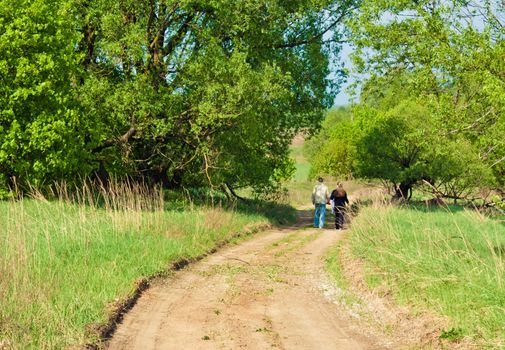 Young anonymous couple taking a walk on nature