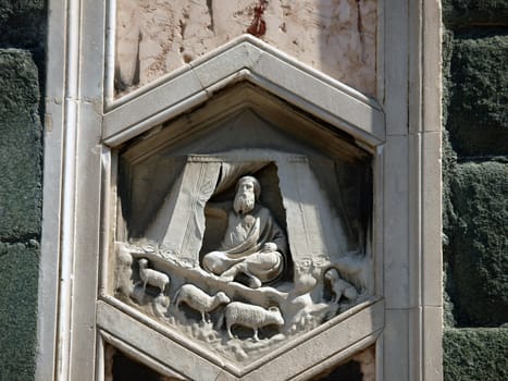 Florence - The hexagonal Relief on the Giottos' Campanile.The hexagonal panels on the lower level depict the history of mankind, inspired by Genesis.