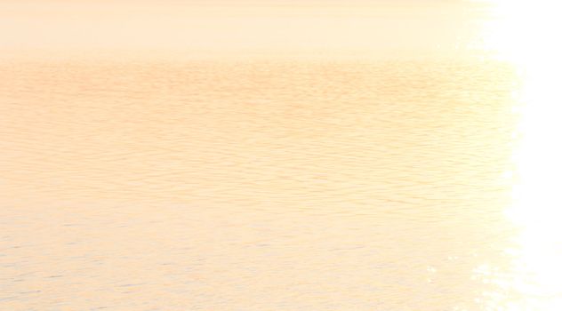 Colour, motion and pattern of a lake at sunset