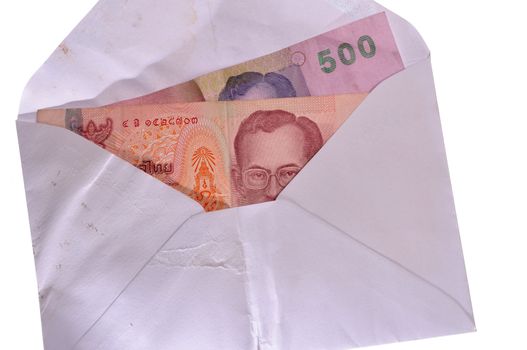 banknotes in an envelope isolated on a white background