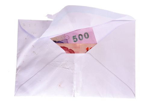 banknotes in an envelope isolated on a white background