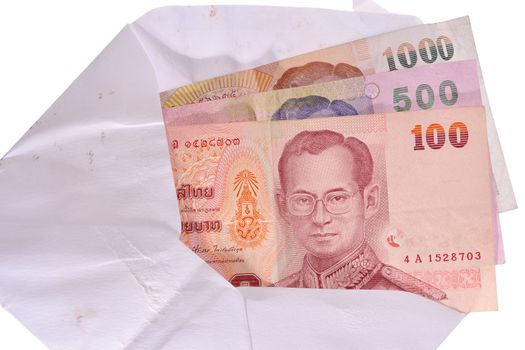 banknotes in an envelope isolated on a white background