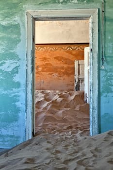 dune in a house at kolmanskop ghost town near luderitz namibia africa