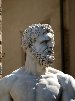 Florence - Sculpture Hercules and Cacus by Bandinelli. The white marble sculpture Hercules and Cacus is to the right of the entrance of the Palazzo Vecchio in the Piazza della Signoria, Florence, Italy.