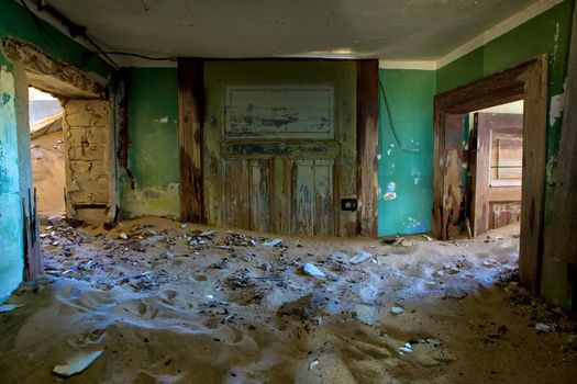 house full of sand in kolmanskop namibia