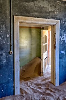 house overtaken by dune sand at kolmanskop ghost town near luderitz namibia