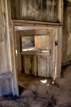 house overtaken by dune sand at kolmanskop near luderitz namibia africa