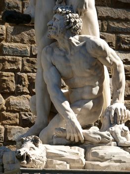 Florence - Sculpture Hercules and Cacus by Bandinelli. The white marble sculpture Hercules and Cacus is to the right of the entrance of the Palazzo Vecchio in the Piazza della Signoria, Florence, Italy.